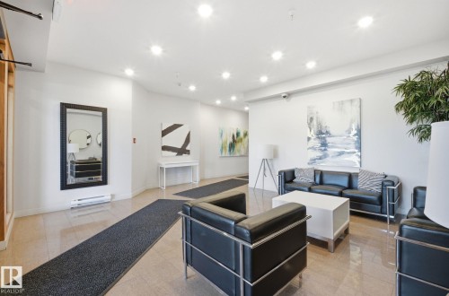 Living room with recessed lighting and baseboard heating - 309 625 Leger Way, Edmonton, AB - Indoor