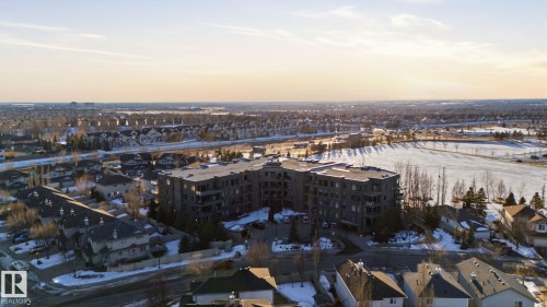 Aerial view at dusk - 309 625 Leger Way, Edmonton, AB - Outdoor With View