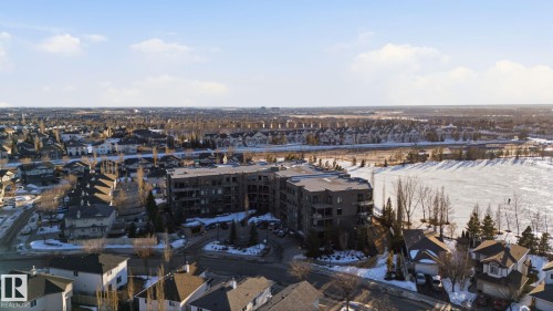 Aerial perspective of suburban area - 309 625 Leger Way, Edmonton, AB - Outdoor With View
