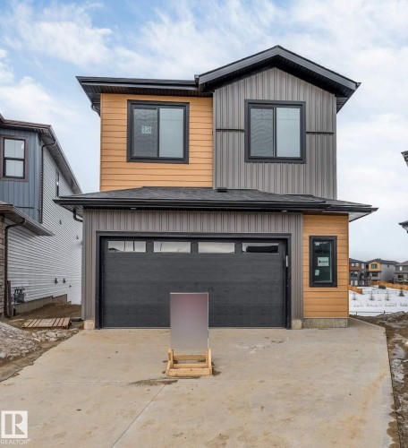 Contemporary house featuring concrete driveway and an attached garage - 13 Trill Point(E), Spruce Grove, AB - Outdoor