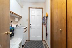 Garage entrance complete with upper laundry area if desired. - 