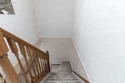 Carpeted stairs from main floor to basement - 