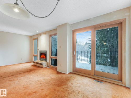 185 Hearthstone, Edmonton, AB - Indoor Photo Showing Other Room With Fireplace