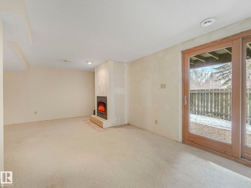 185 Hearthstone, Edmonton, AB - Indoor Photo Showing Other Room With Fireplace