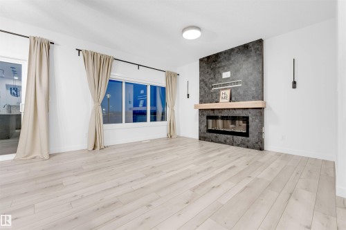 19135 22 Avenue, Edmonton, AB - Indoor Photo Showing Living Room With Fireplace