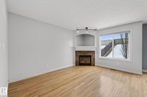95 Hartwick Loop, Spruce Grove, AB - Indoor Photo Showing Living Room With Fireplace