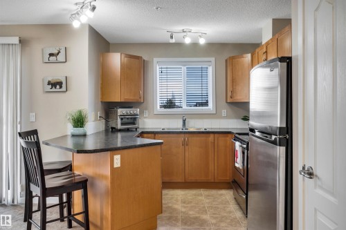 215 392 Silver Berry Road, Edmonton, AB - Indoor Photo Showing Kitchen With Stainless Steel Kitchen With Double Sink