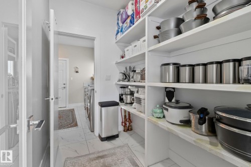 Pantry featuring washer and dryer - 1611 158 Street, Edmonton, AB - Indoor