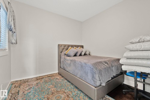 Bedroom featuring baseboards - 1611 158 Street, Edmonton, AB - Indoor Photo Showing Bedroom