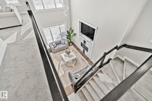 Living room with a high ceiling and carpet flooring - 1611 158 Street, Edmonton, AB - Indoor