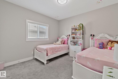 Bedroom featuring light colored carpet and baseboards - 1611 158 Street, Edmonton, AB - Indoor Photo Showing Bedroom
