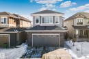 View of front of house with roof with shingles, an attached garage, and concrete driveway - 1611 158 Street, Edmonton, AB  - Outdoor 