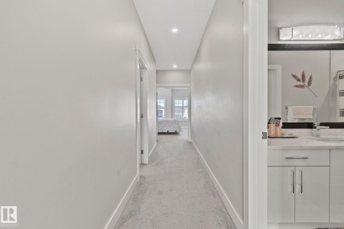 Corridor featuring light carpet and recessed lighting - 1611 158 Street, Edmonton, AB - Indoor