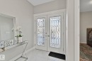 Foyer entrance featuring french doors and light marble finish flooring - 1611 158 Street, Edmonton, AB  - Indoor Photo Showing Other Room 