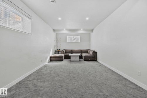Sitting room featuring carpet and recessed lighting - 1611 158 Street, Edmonton, AB - Indoor Photo Showing Other Room