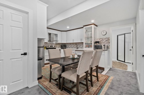 Dining room featuring light carpet and recessed lighting - 1611 158 Street, Edmonton, AB - Indoor Photo Showing Dining Room