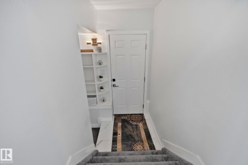 Stairway featuring baseboards - 1611 158 Street, Edmonton, AB - Indoor Photo Showing Other Room