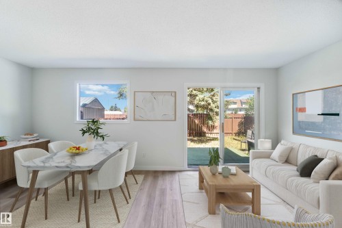 Living room with light wood finished floors and baseboards - 1096 Millbourne Road E, Edmonton, AB - Indoor
