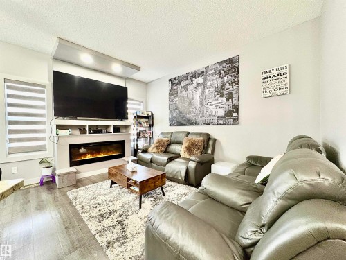 14 Hickory Road, Fort Saskatchewan, AB - Indoor Photo Showing Living Room With Fireplace