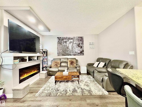 14 Hickory Road, Fort Saskatchewan, AB - Indoor Photo Showing Living Room With Fireplace