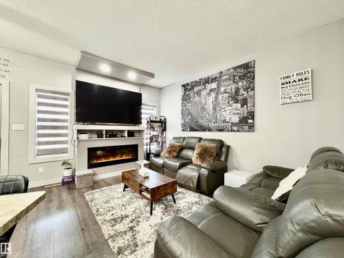 14 Hickory Road, Fort Saskatchewan, AB - Indoor Photo Showing Living Room With Fireplace