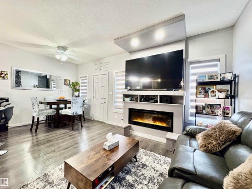 14 Hickory Road, Fort Saskatchewan, AB - Indoor Photo Showing Living Room With Fireplace