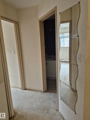 Corridor featuring unfinished concrete floors - 410 17467 98A Avenue, Edmonton, AB - Indoor