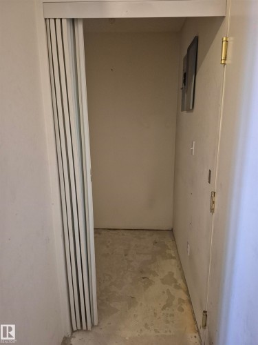 Hall featuring concrete floors and electric panel - 410 17467 98A Avenue, Edmonton, AB - Indoor Photo Showing Other Room