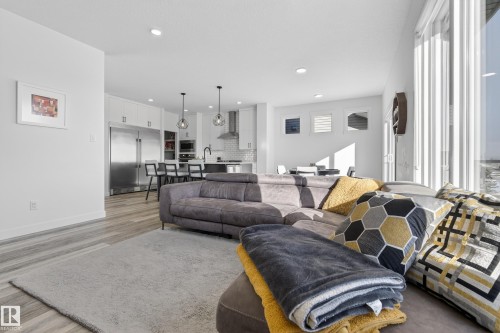 Living room with light wood finished floors and recessed lighting - 9727 205 Street, Edmonton, AB - Indoor Photo Showing Living Room