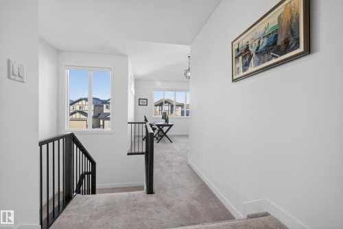 Hallway featuring an upstairs landing and light colored carpet - 9727 205 Street, Edmonton, AB - Indoor Photo Showing Other Room