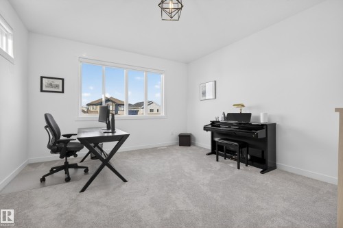 Office area with light carpet and baseboards - 9727 205 Street, Edmonton, AB - Indoor Photo Showing Office