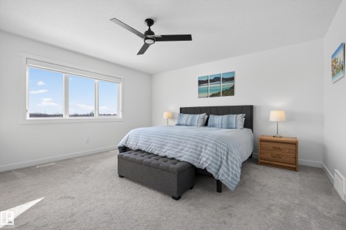 Bedroom with ceiling fan and light carpet - 9727 205 Street, Edmonton, AB - Indoor Photo Showing Bedroom
