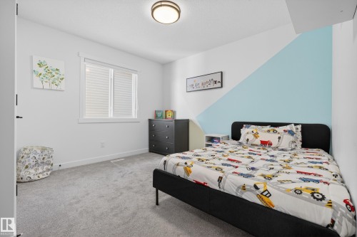 Bedroom featuring light colored carpet and baseboards - 9727 205 Street, Edmonton, AB - Indoor Photo Showing Bedroom