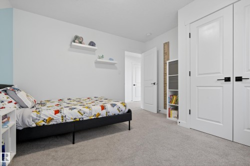Bedroom featuring light carpet and a closet - 9727 205 Street, Edmonton, AB - Indoor Photo Showing Bedroom
