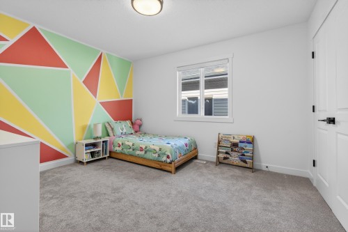 Bedroom with light carpet and baseboards - 9727 205 Street, Edmonton, AB - Indoor Photo Showing Bedroom