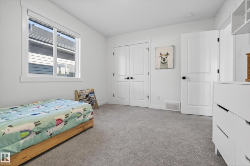 Bedroom with light colored carpet and a closet - 9727 205 Street, Edmonton, AB - Indoor Photo Showing Bedroom