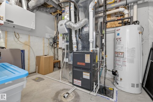 Utility room with water heater and heating unit - 9727 205 Street, Edmonton, AB - Indoor Photo Showing Basement