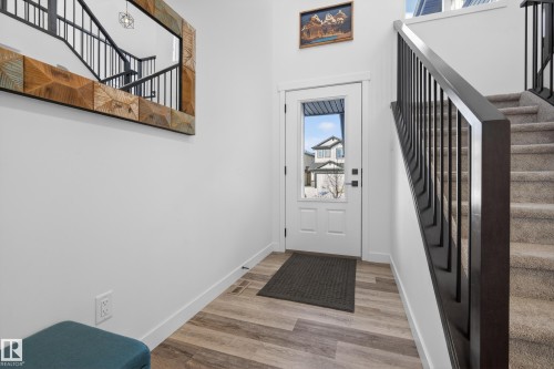 Entryway with wood finished floors and a high ceiling - 9727 205 Street, Edmonton, AB - Indoor Photo Showing Other Room
