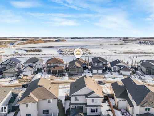 Snowy aerial view featuring a residential view - 117 Mcdowell Wynd, Leduc, AB - Outdoor With View