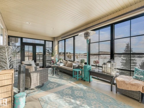 Sunroom / solarium with french doors and healthy amount of natural light - 117 Mcdowell Wynd, Leduc, AB -  With Deck Patio Veranda