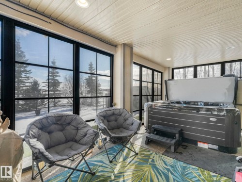 Sunroom featuring a jacuzzi and recessed lighting - 117 Mcdowell Wynd, Leduc, AB -  With Deck Patio Veranda With Exterior