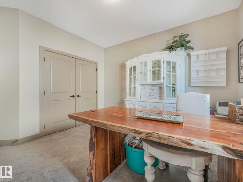 Office space featuring light colored carpet and baseboards - 117 Mcdowell Wynd, Leduc, AB - Indoor Photo Showing Other Room