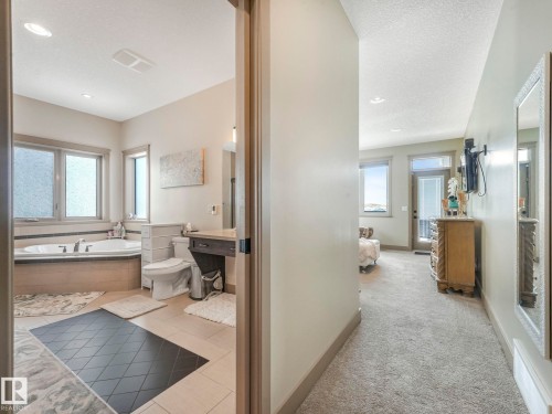 Full bathroom featuring light colored carpet, a garden tub, light tile patterned floors, recessed lighting, and a textured ceiling - 117 Mcdowell Wynd, Leduc, AB - Indoor Photo Showing Bathroom