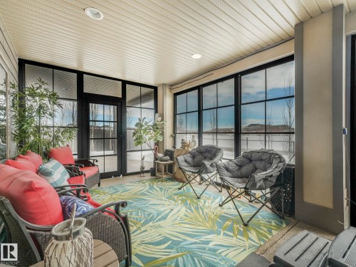 Sunroom / solarium featuring an outdoor hangout area - 117 Mcdowell Wynd, Leduc, AB - Outdoor With Deck Patio Veranda With Exterior