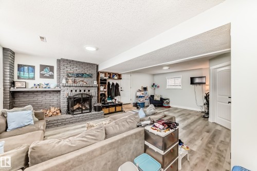 42 Alexander Drive, Leduc, AB - Indoor Photo Showing Living Room With Fireplace
