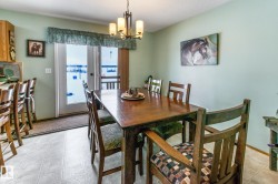 Dining room with baseboards and a chandelier - 