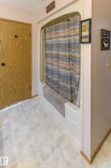 Full bath with light tile patterned floors and a textured ceiling - 
