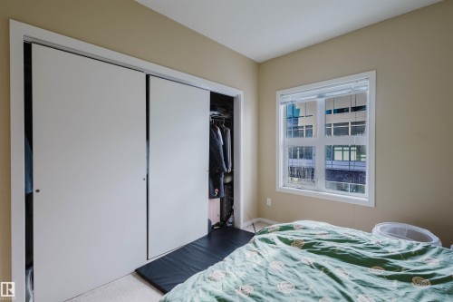Bedroom with a closet - 207 9910 111 Street, Edmonton, AB - Indoor Photo Showing Bedroom