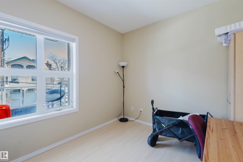 Office space with baseboards and light wood-style floors - 207 9910 111 Street, Edmonton, AB - Indoor