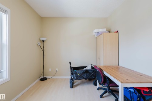 Office area featuring light wood-style flooring and baseboards - 207 9910 111 Street, Edmonton, AB - Indoor Photo Showing Office